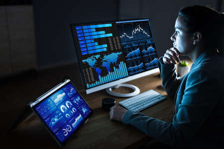 Business Woman Analyst Using KPI Data On Computer