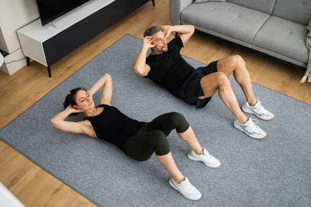 Core Exercise Workout. Family Couple Training At Home