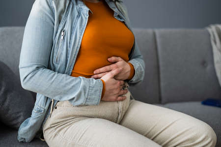 Women Suffering From PMS Or Digestion Constipation Stomach Problemの写真素材