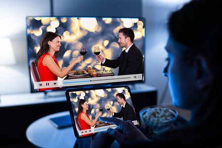 Woman Watching TV Through Tablet Television And Movie Streaming