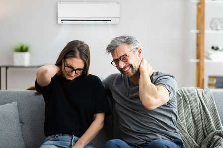 Air Conditioner Couple Sneezing And Having Sore Neck