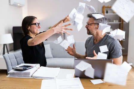 Family With Money Issue And Debt. Sad Couple Fighting
