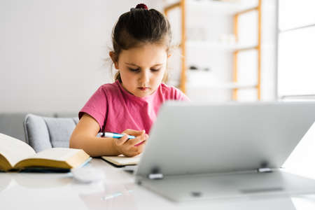 Child With Digital Tablet Drawing And Writing