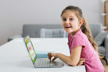 Excited Child Studying Solving Math On Laptop Computer