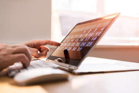 Digital Calendar Agenda On Tablet Screen. Looking Up Week Plannerの写真素材