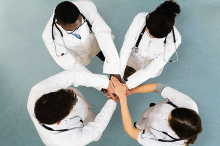 Diverse Medical Healthcare Staff Team Hands Stackの写真素材