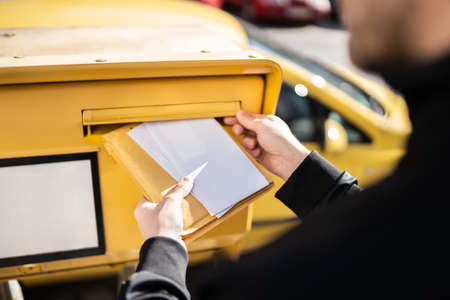Letter In Envelope Or Document In Mailbox. Man Hand Sending Mail