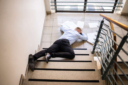 Slip Fall Accident. Fell Down On Stairsの写真素材