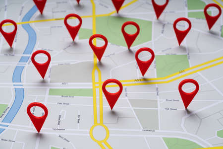Close-up Of A Road Map With Red Navigation Icons