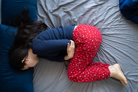 Woman With Stomach Pain And Ache From Indigestion
