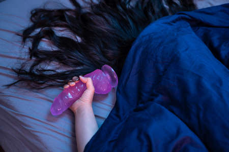 Female Person With Dildo Toy In Hand Having Orgasmの写真素材