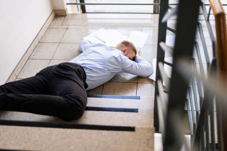 Slip Fall Accident. Fell Down On Stairsの写真素材