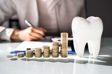 Dental Implant Bill And Financing. Dentist In Clinicの写真素材