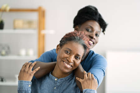 African Teen Support For Elderly Mature Mother