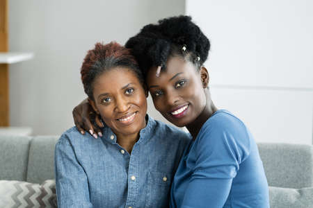 African Teen Support For Elderly Mature Mother