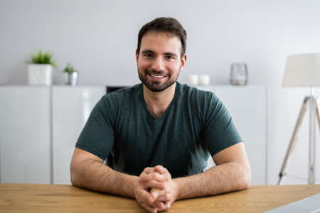 Happy Man Video Conference Webinar Portrait At Homeの写真素材