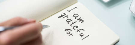 Gratitude Journal Concept. Writing I Am Grateful In Journalの写真素材