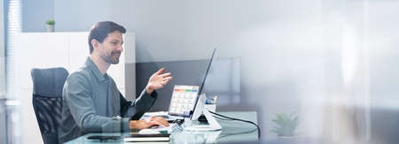 Man In Virtual Conference Training Meeting On Computerの写真素材