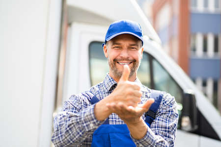 Happy Technician Worker Using Sign Language For Disabledの写真素材