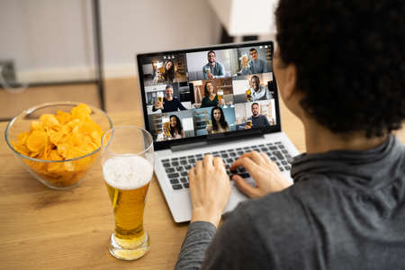 Virtual Beer Drink Online Party Using Laptopの写真素材