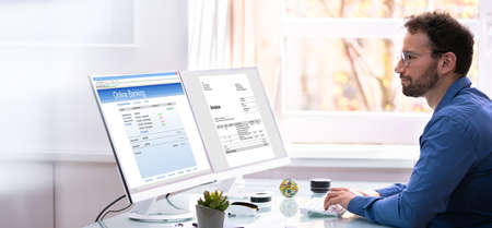 Business Invoice Tax Management. Accountant Using Monitor