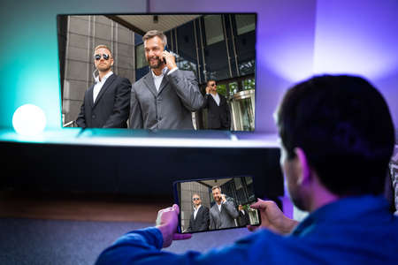 Streaming TV Movie. Man Watching Video On Television Screen