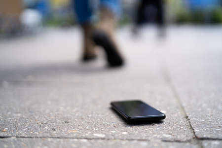 Woman Lost Mobile Phone. Walking On Street