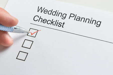 Wedding Planning Checklist. Hand Filling Check Listの写真素材