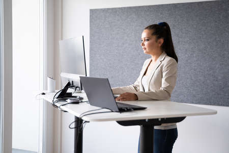Adjustable Height Office Desk. Working While Standingの写真素材