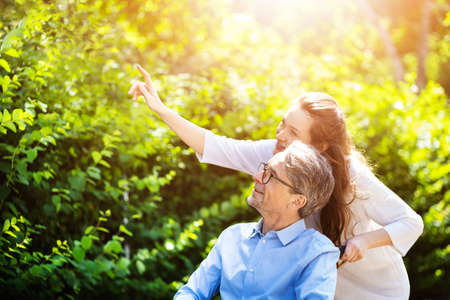 Elderly Senior Patient Care Outside. Older Man In Wheelchairの写真素材