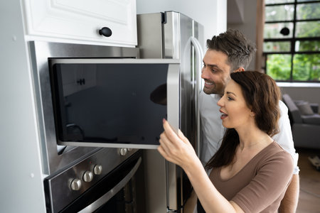 Couple Microwave Electrical Oven With Consumer Loan Creditの写真素材