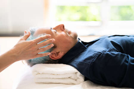 Reiki Therapy Alternative Healing Massage For Manの写真素材
