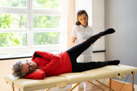 Physiotherapist Doing Thigh Rehabilitation Physio Therapy Massage