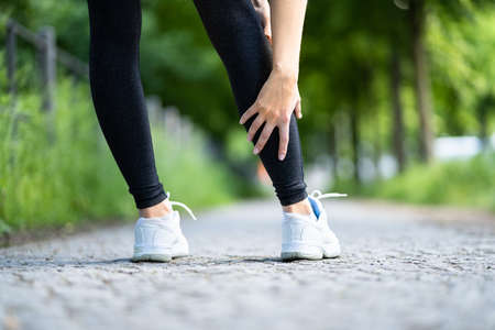 Calf Injury And Cramp Pain. Sport Athlete Joggingの写真素材