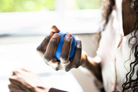 Woman Holding Stress Relief Ball. Business Tensionの写真素材