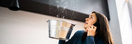 Ceiling Damage Water Leak In House. Calling Plumberの写真素材