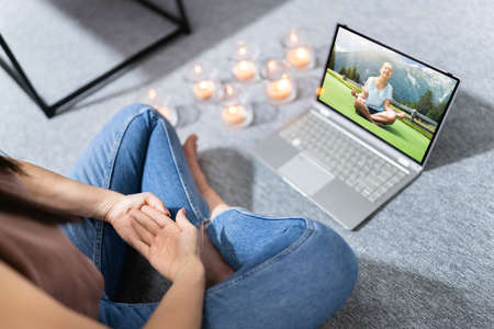 Online Yoga Video Call On Laptop Computer Screenの写真素材