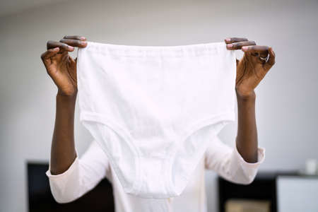 African American Woman Holding Granny Underwear Panties