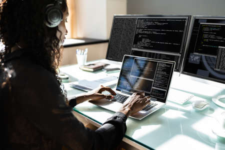 African American Woman Programmer. Girl Coding On Computerの写真素材