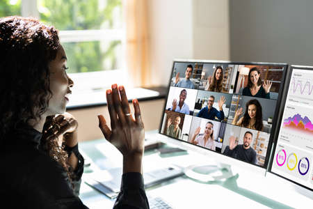 Virtual Video Conference Interview In Office Waving Hand
