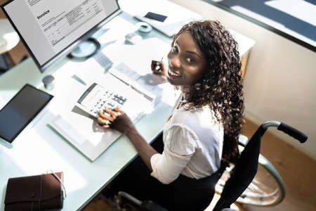 Disabled Professional Accountant African Lady In Wheelchairの写真素材
