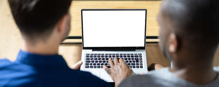 Couple Looking At Empty Laptop Computer Screen