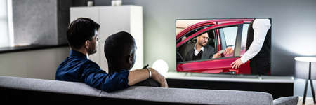 Gay Couple Watching TV Movie In Living Room