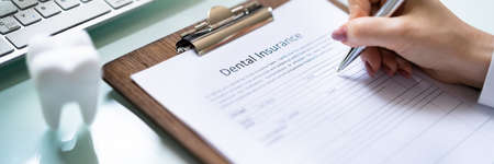 Dental Insurance Form On Desk. Dentist Teeth Service