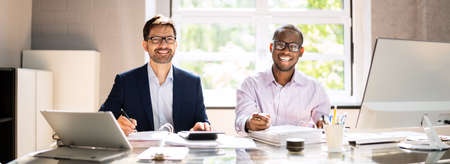 Tax Compliance And Invoice Accounting Using Calculator In Officeの写真素材