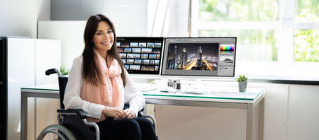 Designer Editing Photo. Woman Working In Wheelchair