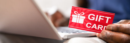 African American Using Gift Card For Shoppingの写真素材