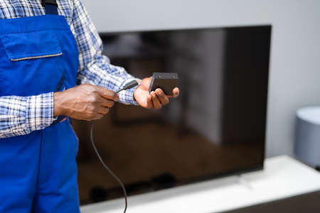 Installing Satellite Television Service At Home. New Cable Indoorsの写真素材