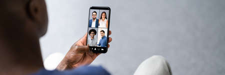 African American Video Conference Call On Mobile Phoneの写真素材
