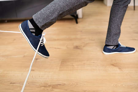 Trip Over Wire Cable. Fall On Office Floorの写真素材